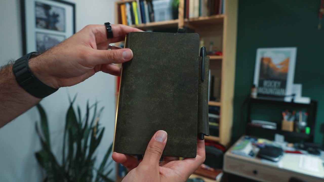 A ring planner open on a desk, being written in by hand