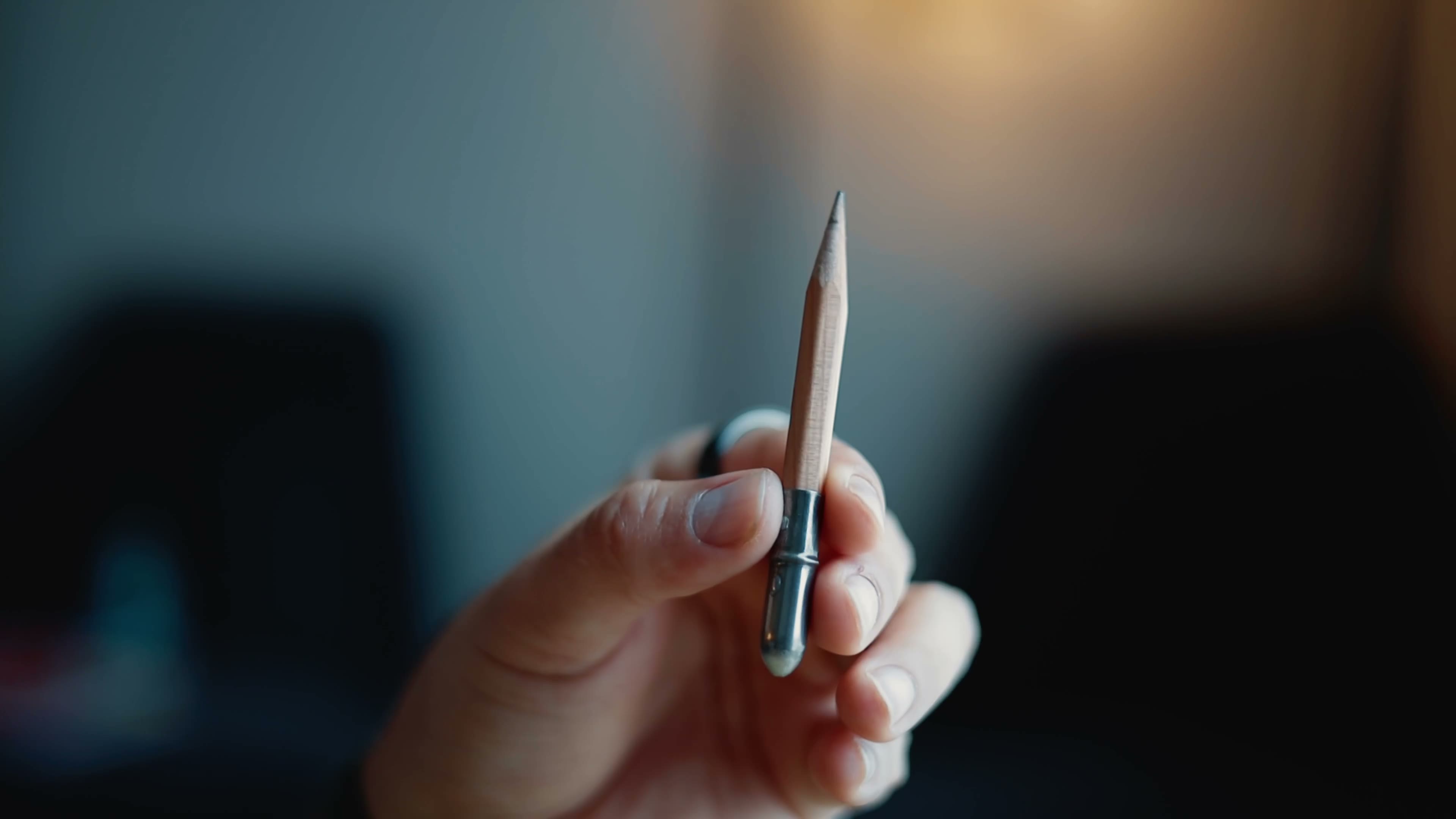 A Traveler's Company brass pencil held in hand