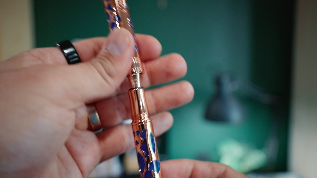 A Conklin Endura Deco Crest fountain pen in hand